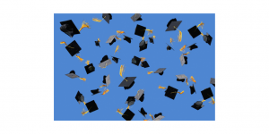 graduation caps thrown in the air