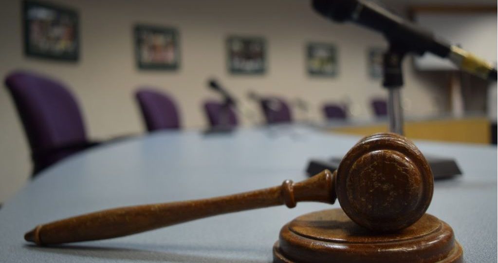 wooden gavel on desk