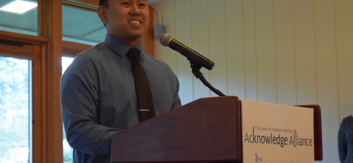 Rob Felicano accepts Outstanding Educator award at Acknowledge Alliance event.