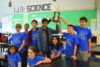 team holds up trophy