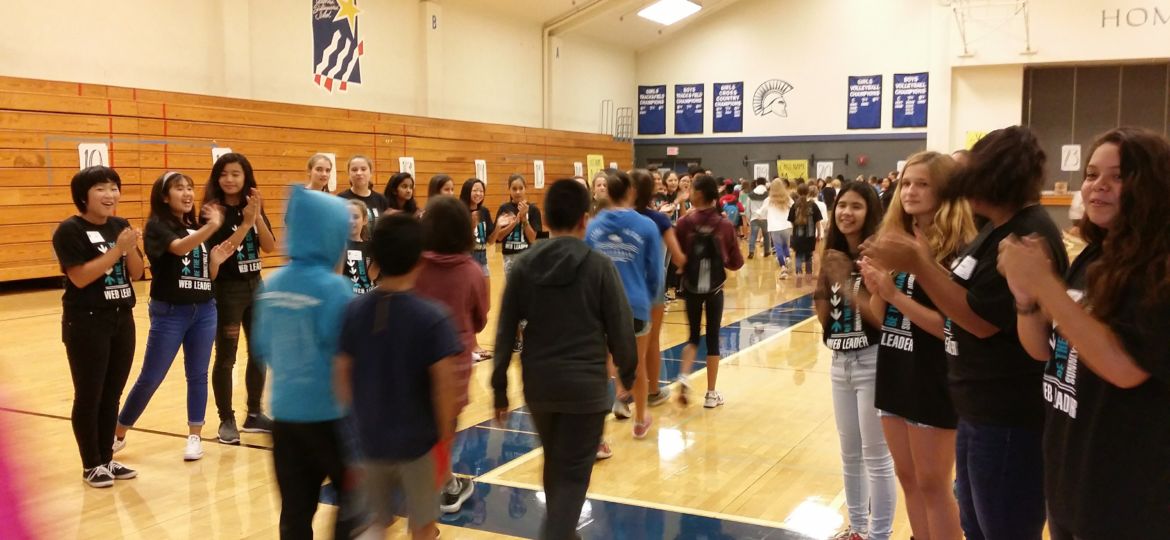 New sixth grade students welcomed by older students