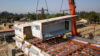 second story classrooms craned on top of first floor