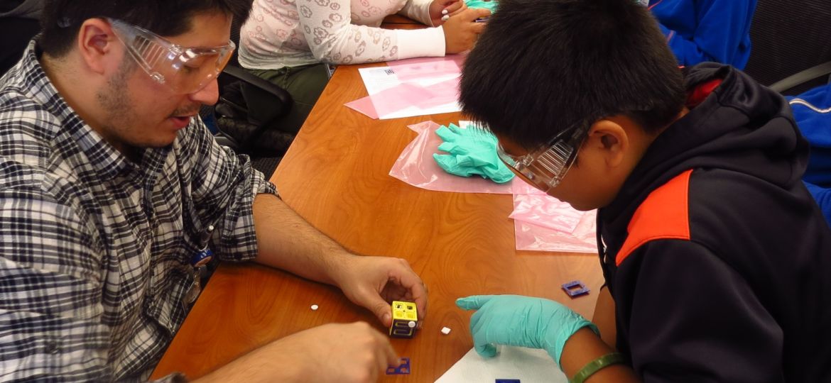 engineer works with CMS student on fidget cube