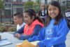 students greet visitors